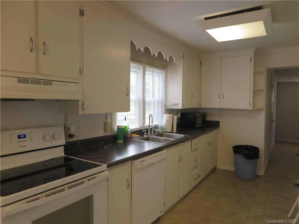 515 Upper Spencer Mountain Road Stanley, NC 28164 - Photo 7 of 28 a kitchen with a sink and cabinets