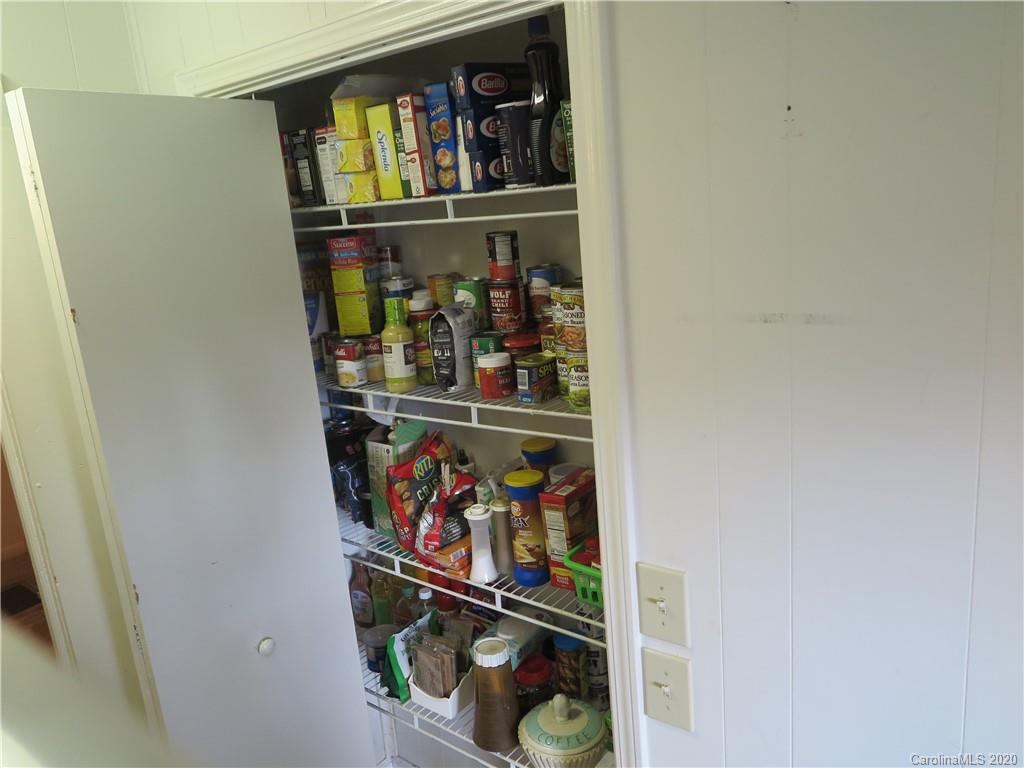 515 Upper Spencer Mountain Road Stanley, NC 28164 - Photo 8 of 28 a room with lots of bottles of alcohol