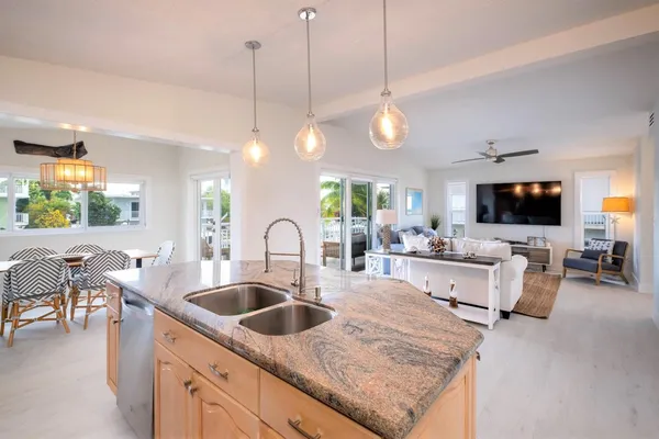 a bathroom with a toilet a sink and shower