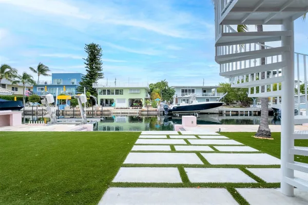 a view of deck with furniture and garden