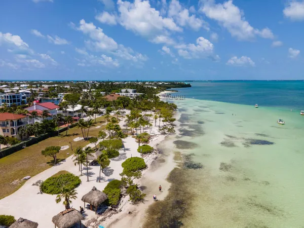 a view of multiple houses with outdoor seating