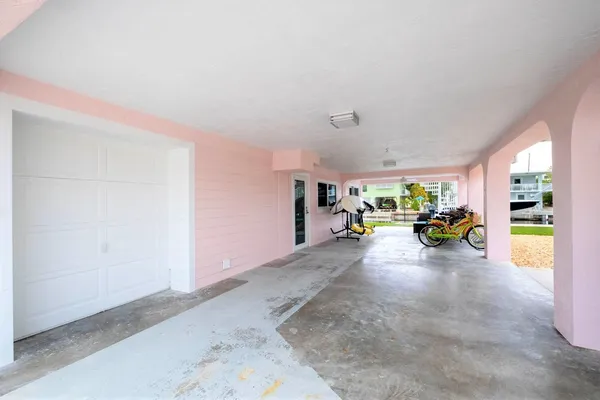 a view of a livingroom and a hall with wooden floor
