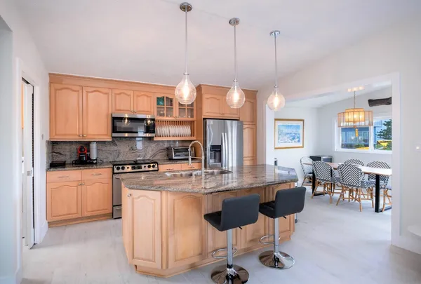 a living room with furniture flat screen tv and window