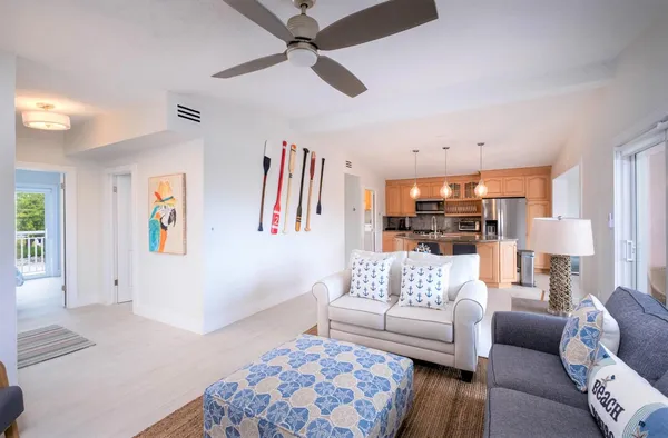 a view of swimming pool with outdoor seating and lake view