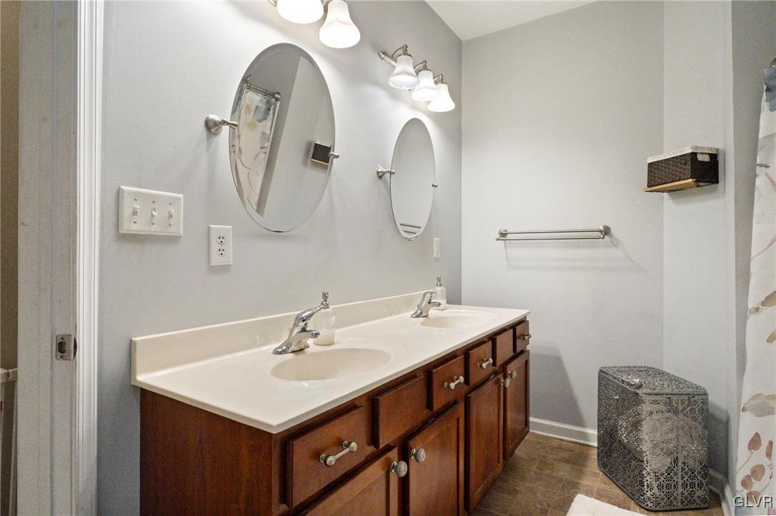 627 9th Avenue Bethlehem, PA 18018 - Photo 20 of 29 a bathroom with a sink vanity and a mirror