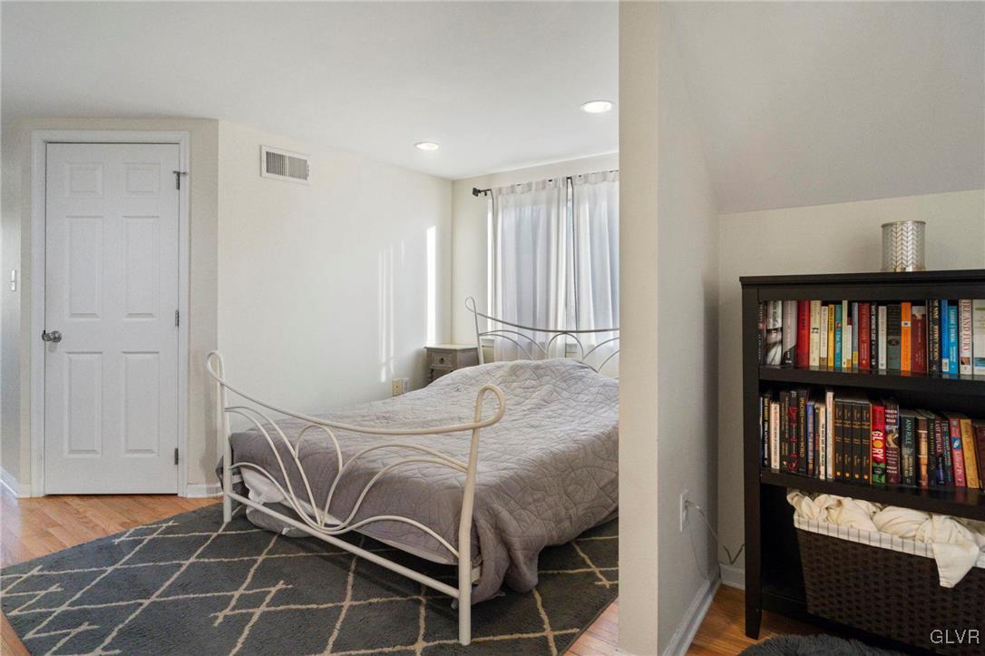 627 9th Avenue Bethlehem, PA 18018 - Photo 27 of 29 a bedroom with a bed and a book shelf