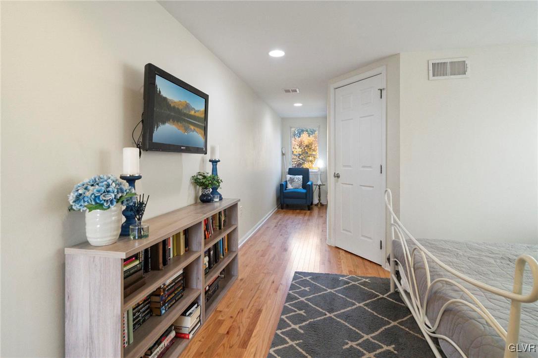 627 9th Avenue Bethlehem, PA 18018 - Photo 28 of 29 a hallway with wooden floor and furniture