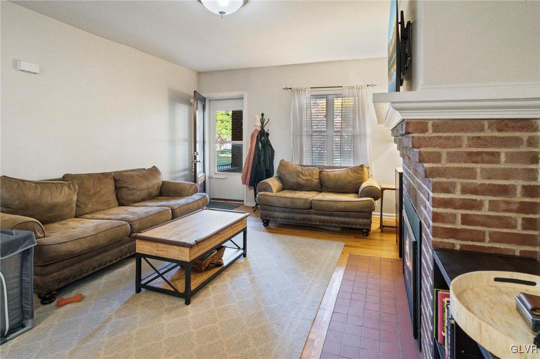 627 9th Avenue Bethlehem, PA 18018 - Photo 7 of 29 a living room with furniture and a fireplace