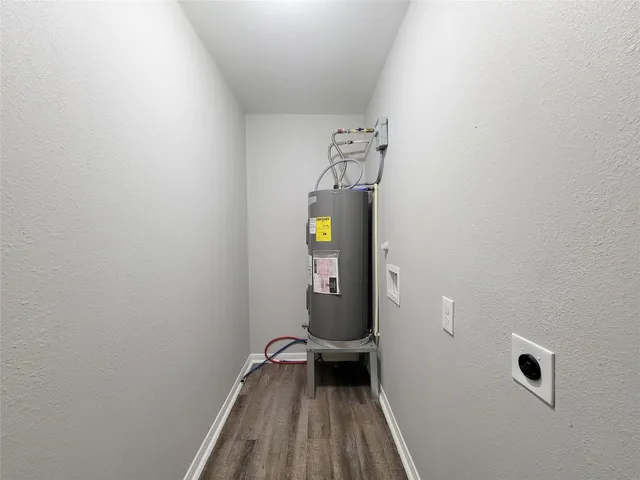 a view of a yard in front of a house with large tree
