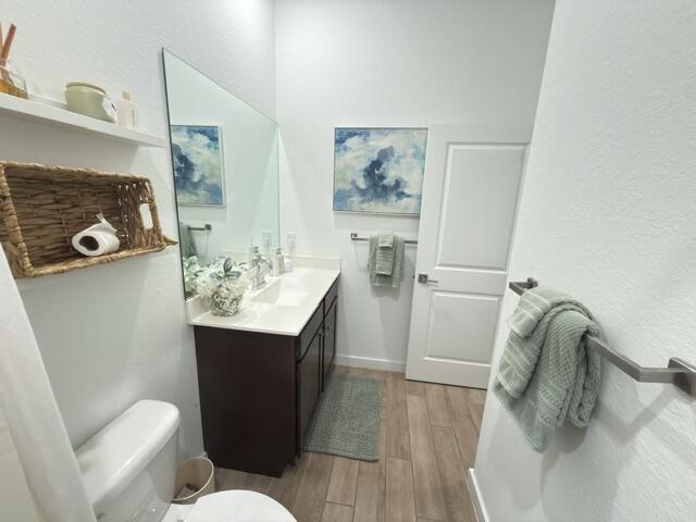19696 Weathervane Way Loxahatchee, FL 33470 - Photo 28 of 39 a bathroom with a sink mirror and toilet