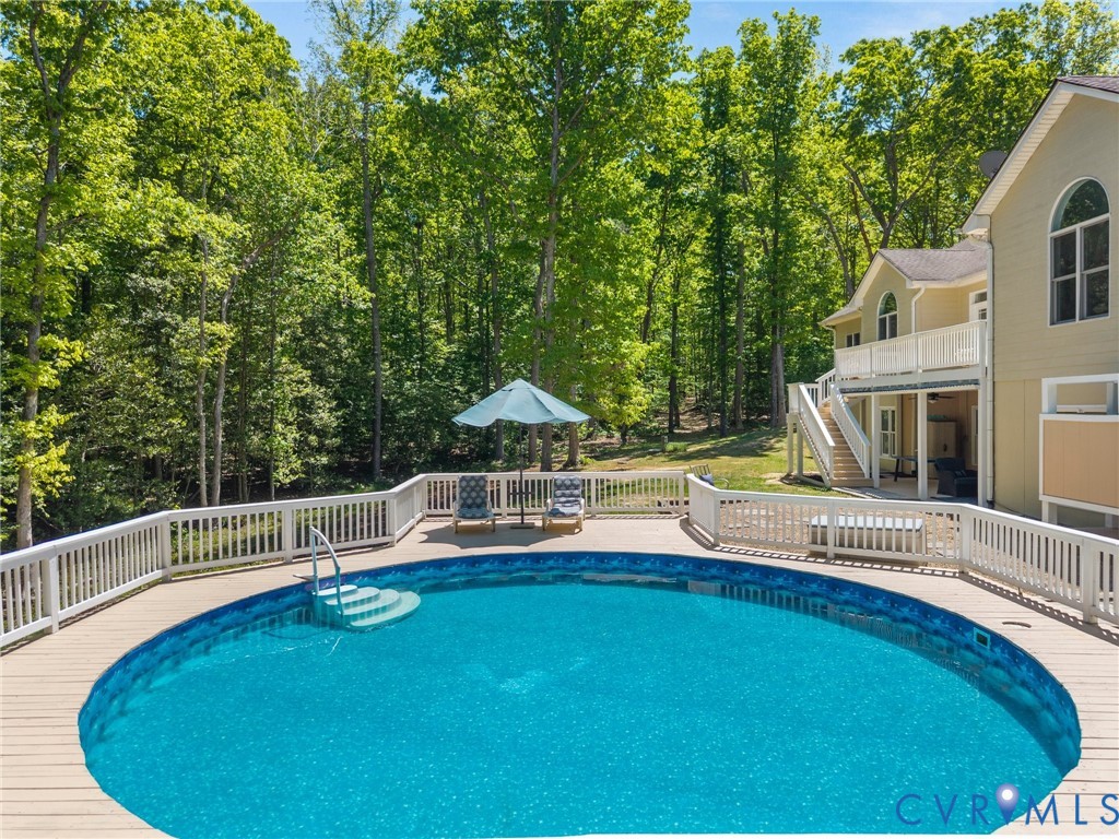 6126 Autumn Bluff Road Powhatan, VA 23139 - Photo 9 of 47 a view of a house with swimming pool and sitting area