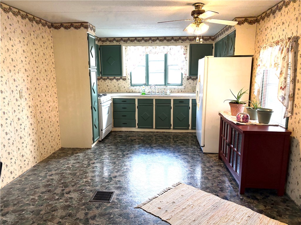 5434 North Waynesville Road, Unit 15 Oregonia, OH 45054 - Photo 15 of 19 This spacious kitchen offers ample room for culinary creativity and everyday living.