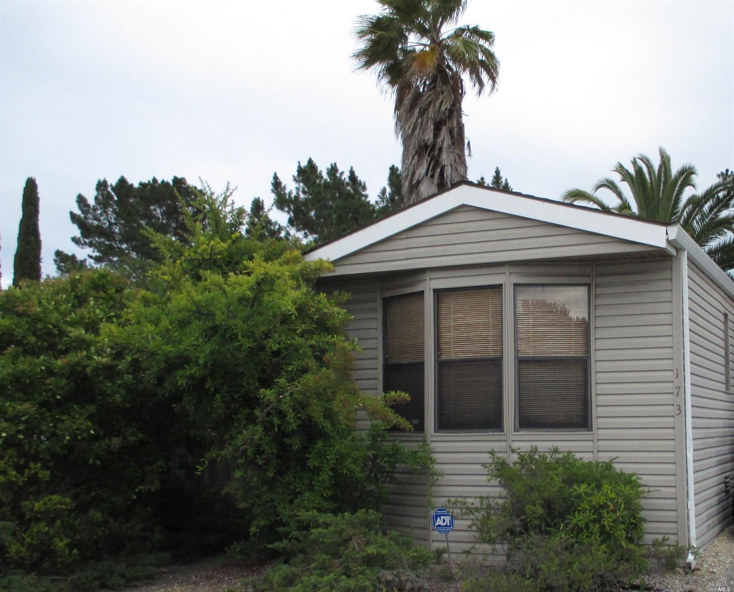 173 Yosemite Road, Unit 173 San Rafael, CA 94903 - Photo 1 of 1 a front view of a house with a garden