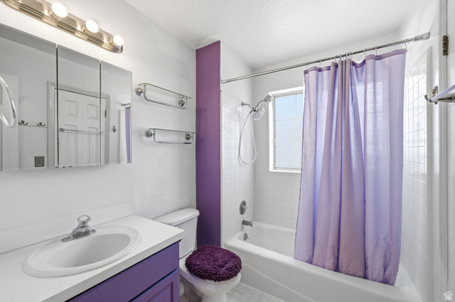 2475 Church Street Layton, UT 84040 - Photo 16 of 27 Full bathroom featuring a white vanity with an integrated sink, a built-in medicine cabinet, and a shower-over-tub combination with white subway tile surround