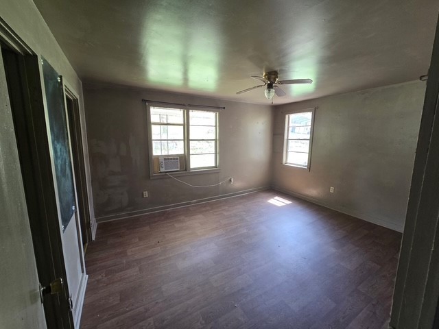 400 Canaan Road Marshall, AR 72650 - Photo 14 of 18 This room features hard surface flooring, a ceiling fan, and two windows allowing for natural light