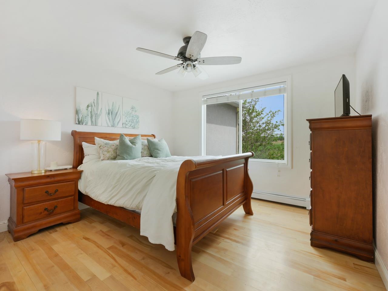 2433 H Road Grand Junction, CO 81505 - Photo 25 of 42 a bedroom with a bed and a dresser