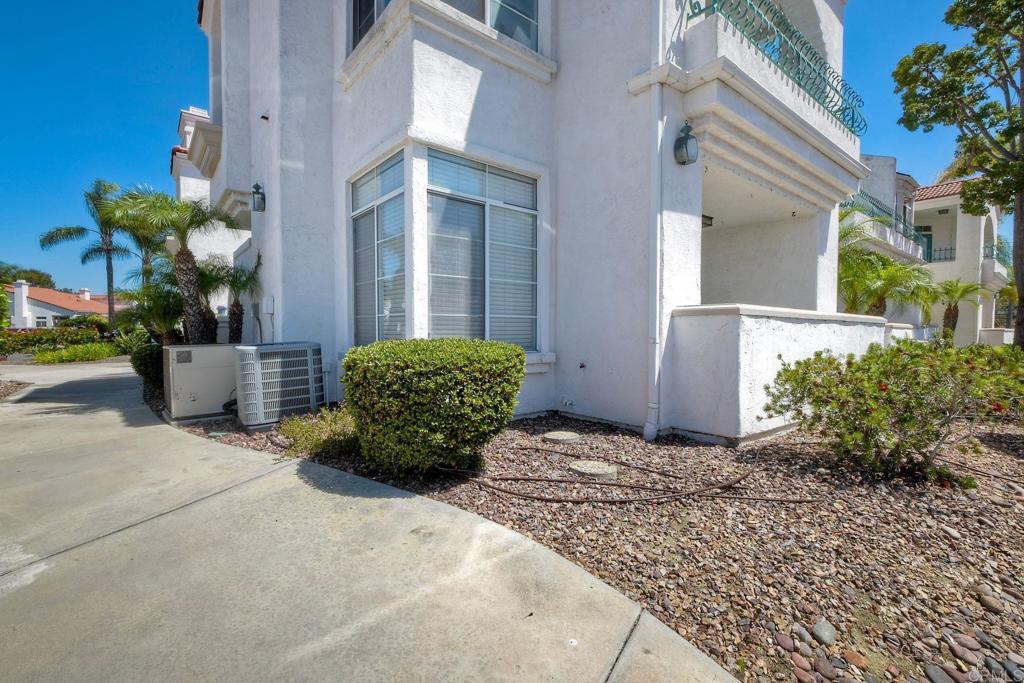 3375 Genoa Way, Unit 144 Oceanside, CA 92056 - Photo 3 of 34 Side exterior showing one of the patios
