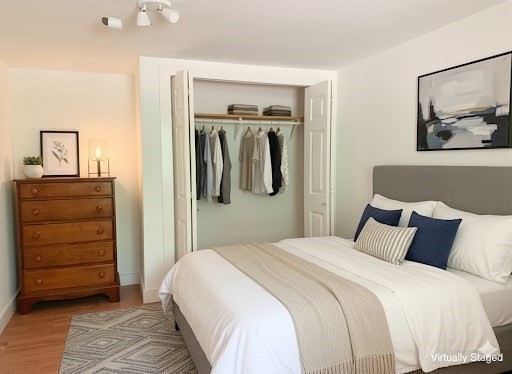 526 Skunknet Road Barnstable, MA 02632 - Photo 18 of 20 a bedroom with a bed and a dresser