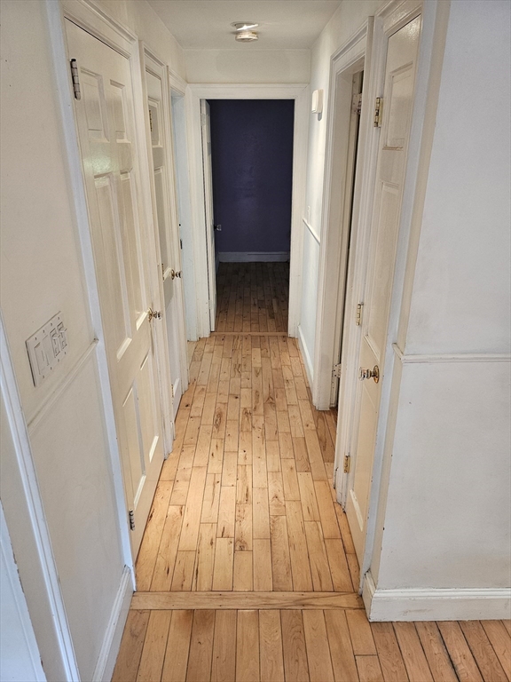 526 Skunknet Road Barnstable, MA 02632 - Photo 6 of 20 a view of a hallway with wooden floor and staircase