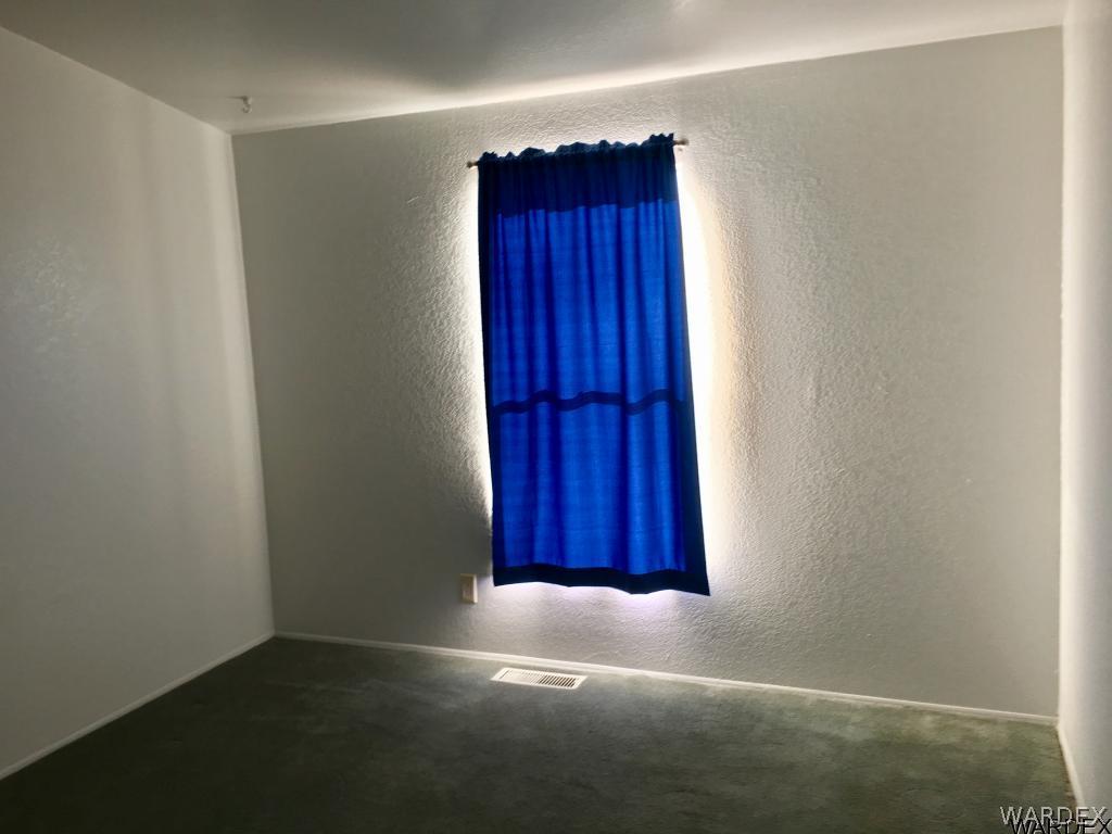 3192 Keystone Road Golden Valley, AZ 86413 - Photo 14 of 36 an empty room with a window