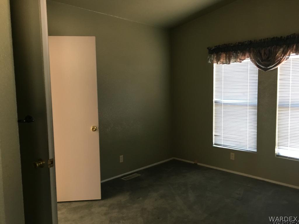 3192 Keystone Road Golden Valley, AZ 86413 - Photo 23 of 36 a view of an empty room with a window