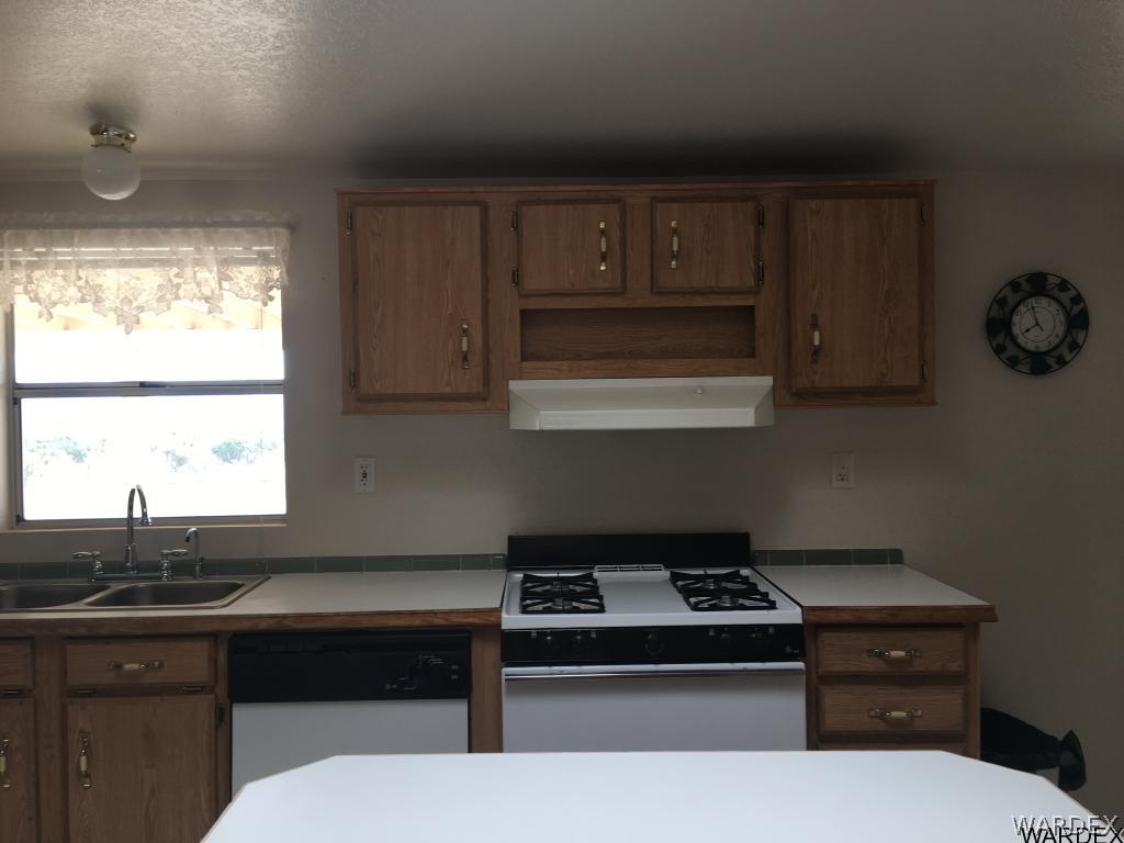 3192 Keystone Road Golden Valley, AZ 86413 - Photo 27 of 36 a kitchen with a sink cabinets and window
