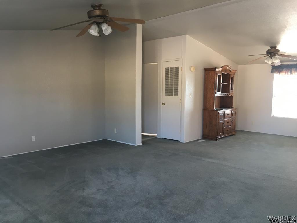 3192 Keystone Road Golden Valley, AZ 86413 - Photo 6 of 36 an empty room with windows and closet