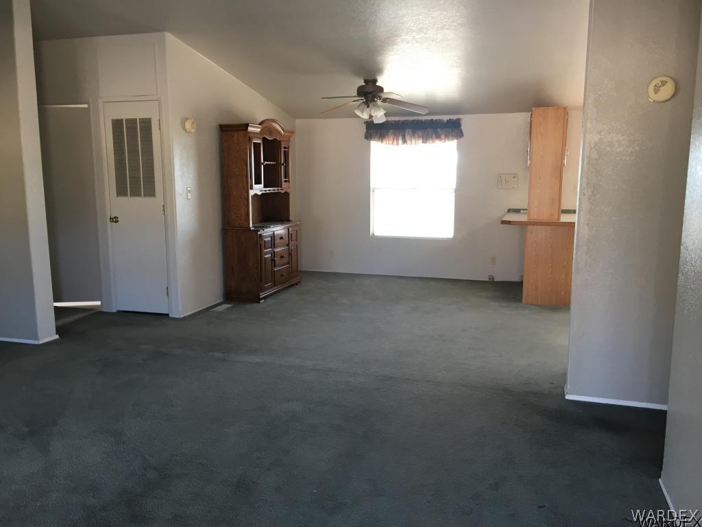 3192 Keystone Road Golden Valley, AZ 86413 - Photo 8 of 36 an empty room with windows and closet