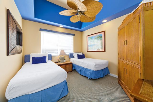 a bedroom with double bed and a window