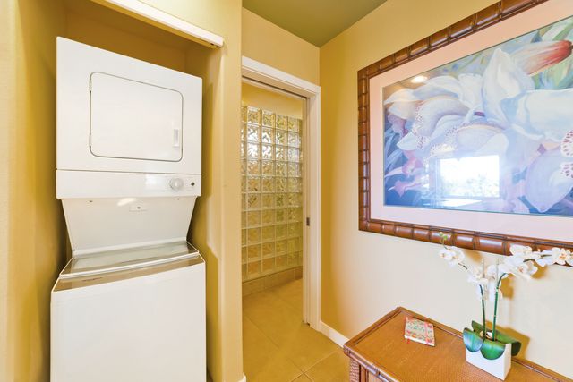 a utility room with a sink dryer and washer