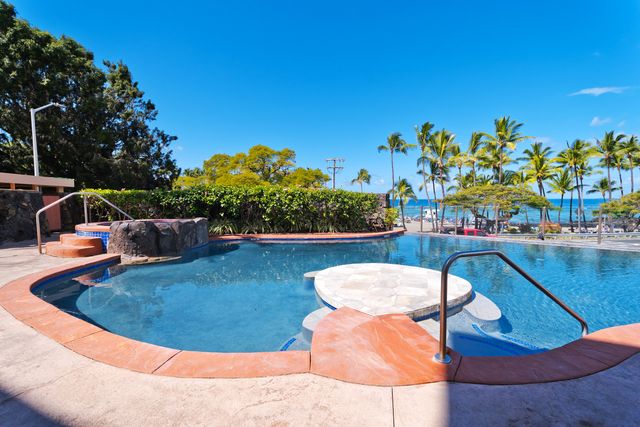 a view of a swimming pool with a chairs