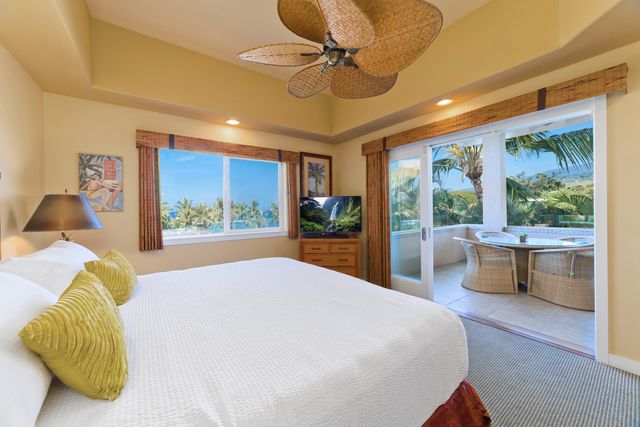 a bed room with a bed and a large window