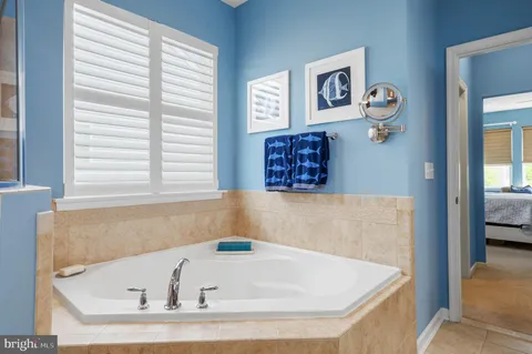 a bathroom with a sink double vanity and a mirror