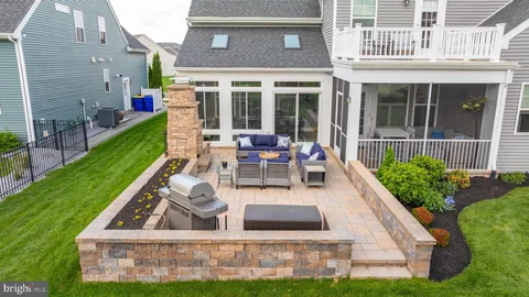 an aerial view of a house with a swimming pool