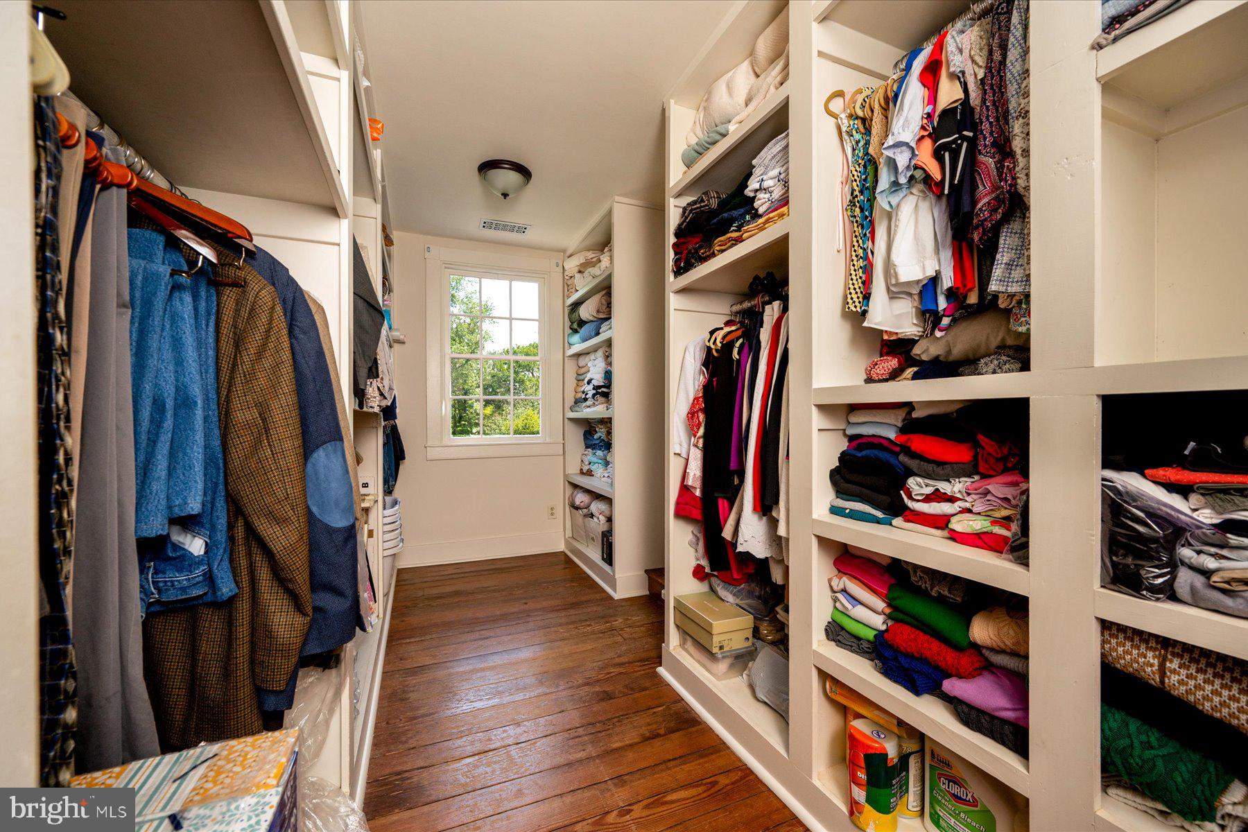 5503 Brooks Woods Road Lothian, MD 20711 - Photo 35 of 99 a view of walk in closet with clothes and shoes
