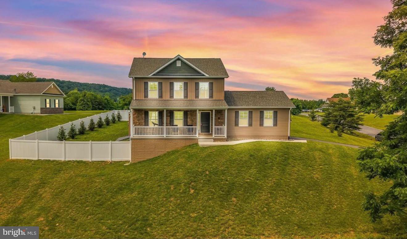 123 Hank Aaron Road Berkeley Springs, WV 25411 - Photo 2 of 32 Charming home with sunset backdrop.