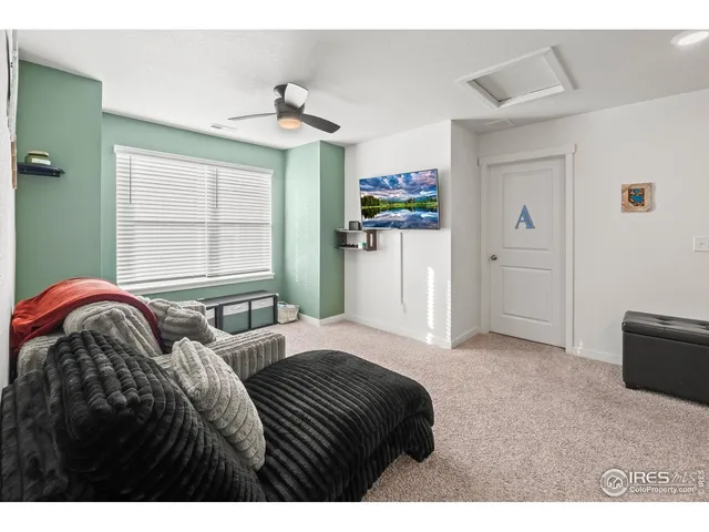 a bedroom with a bed dresser and a window