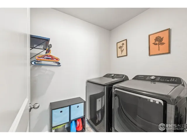 a bedroom with a bed couch and window