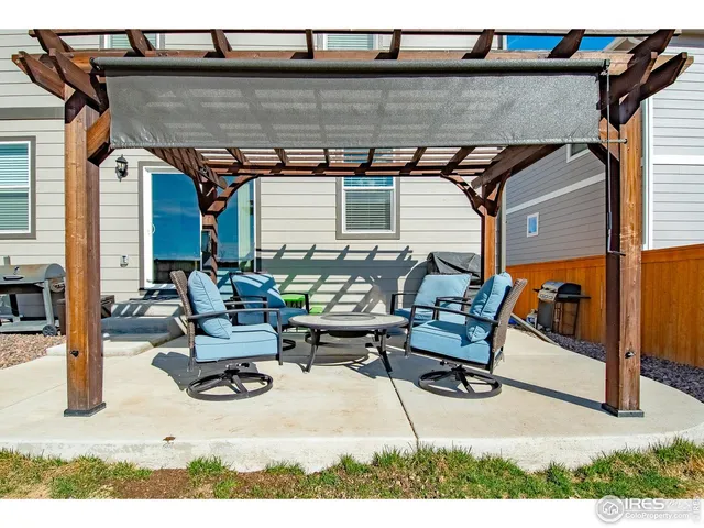 a view of a chairs and table in the patio