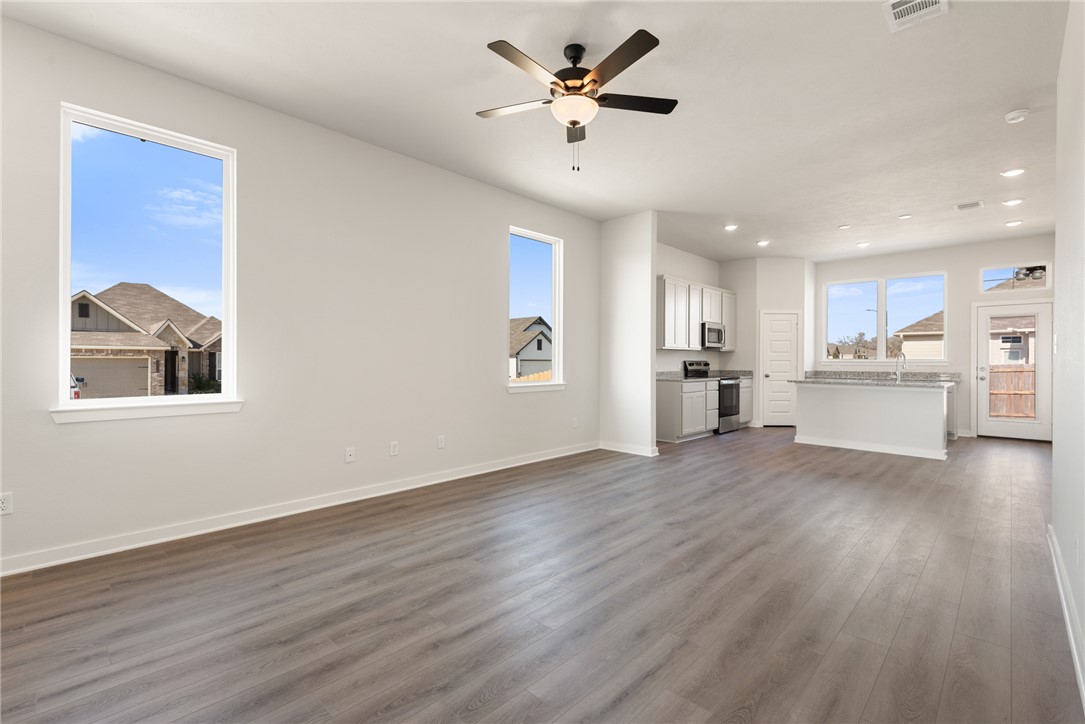 2220 Amber Court Bryan, TX 77807 - Photo 11 of 35 a view of an empty room with window and wooden floor