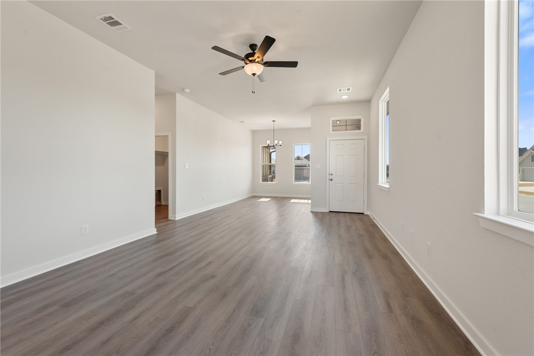 2220 Amber Court Bryan, TX 77807 - Photo 12 of 35 wooden floor in an empty room with a window