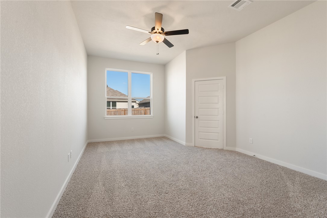 2220 Amber Court Bryan, TX 77807 - Photo 21 of 35 an empty room with closet and windows