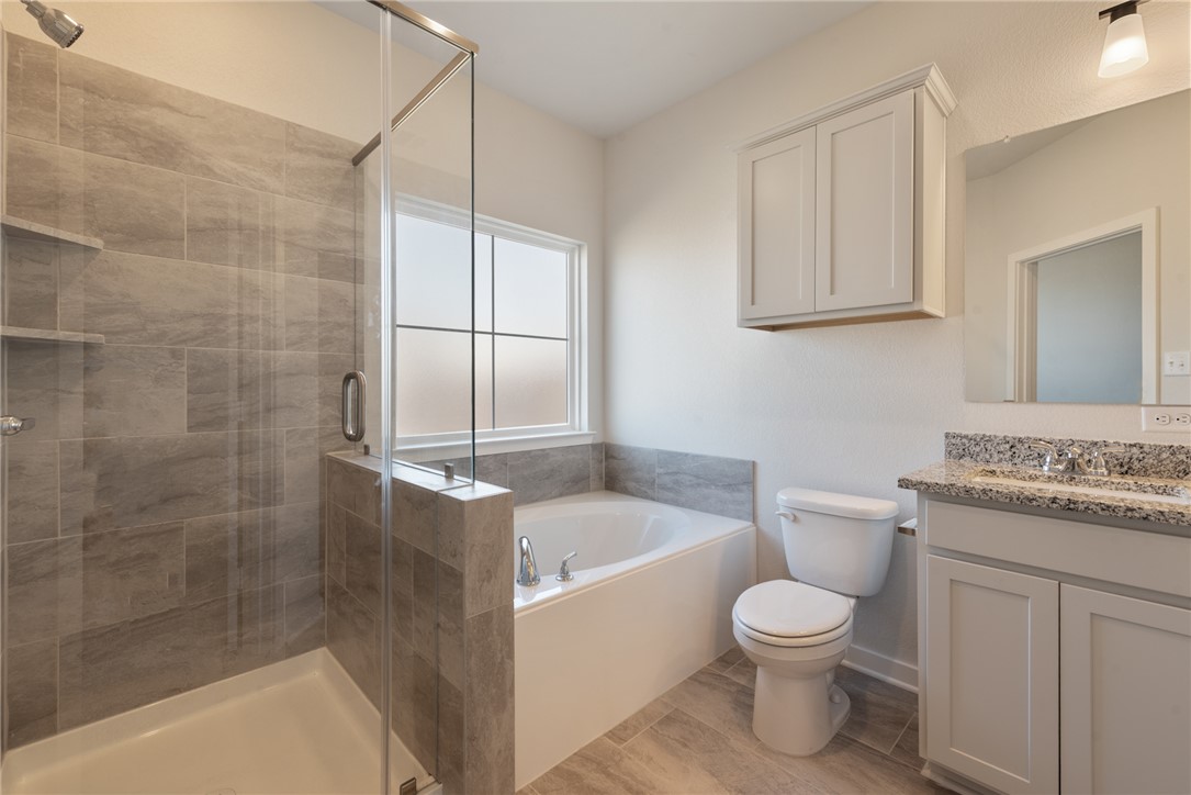 2220 Amber Court Bryan, TX 77807 - Photo 24 of 35 a bathroom with a sink toilet and shower