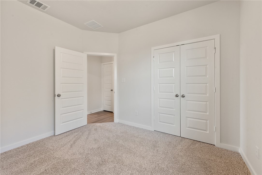2220 Amber Court Bryan, TX 77807 - Photo 29 of 35 wooden floor and closet area
