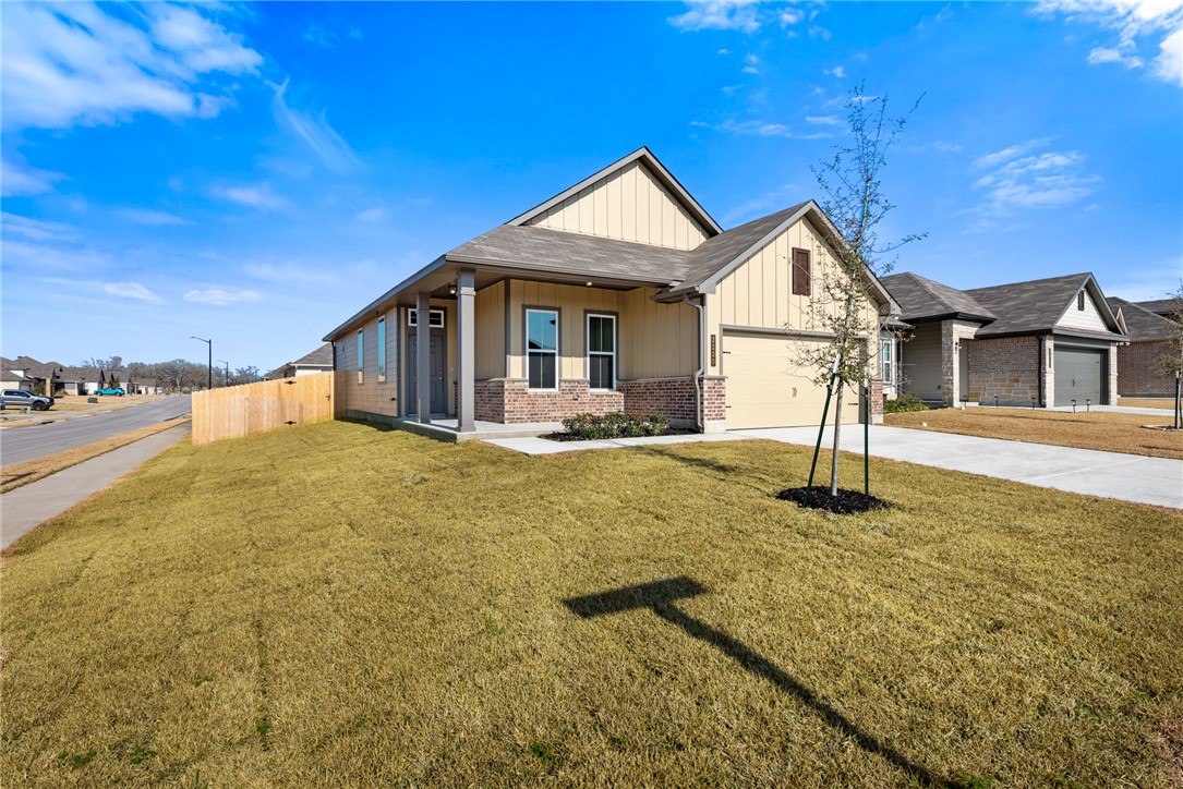 2220 Amber Court Bryan, TX 77807 - Photo 3 of 35 a front view of a house with yard and tree