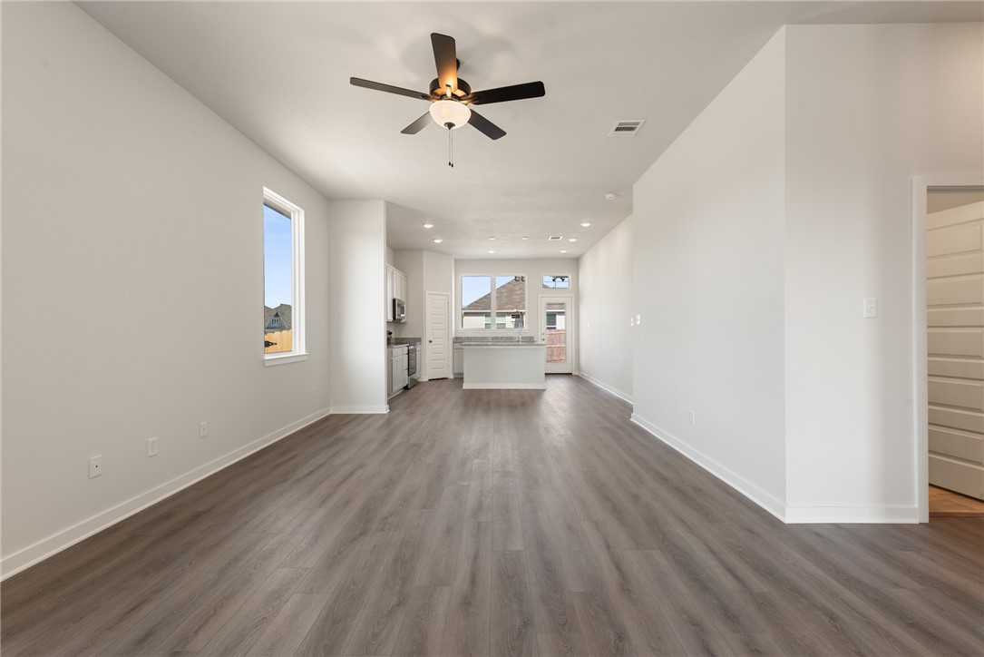 2220 Amber Court Bryan, TX 77807 - Photo 10 of 35 wooden floor in an empty room with a window