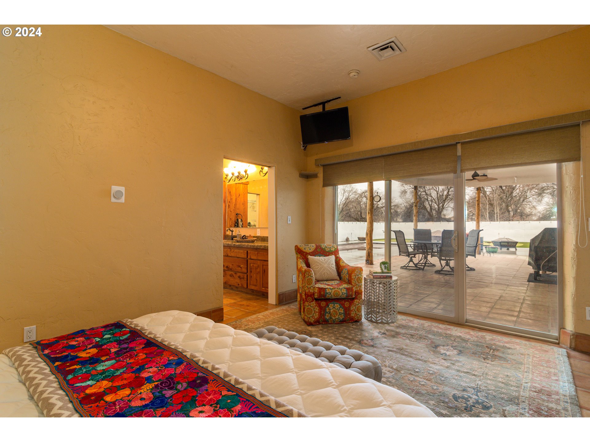 832 East Main Street Hermiston, OR 97838 - Photo 13 of 48 a bedroom with a bed and glass window
