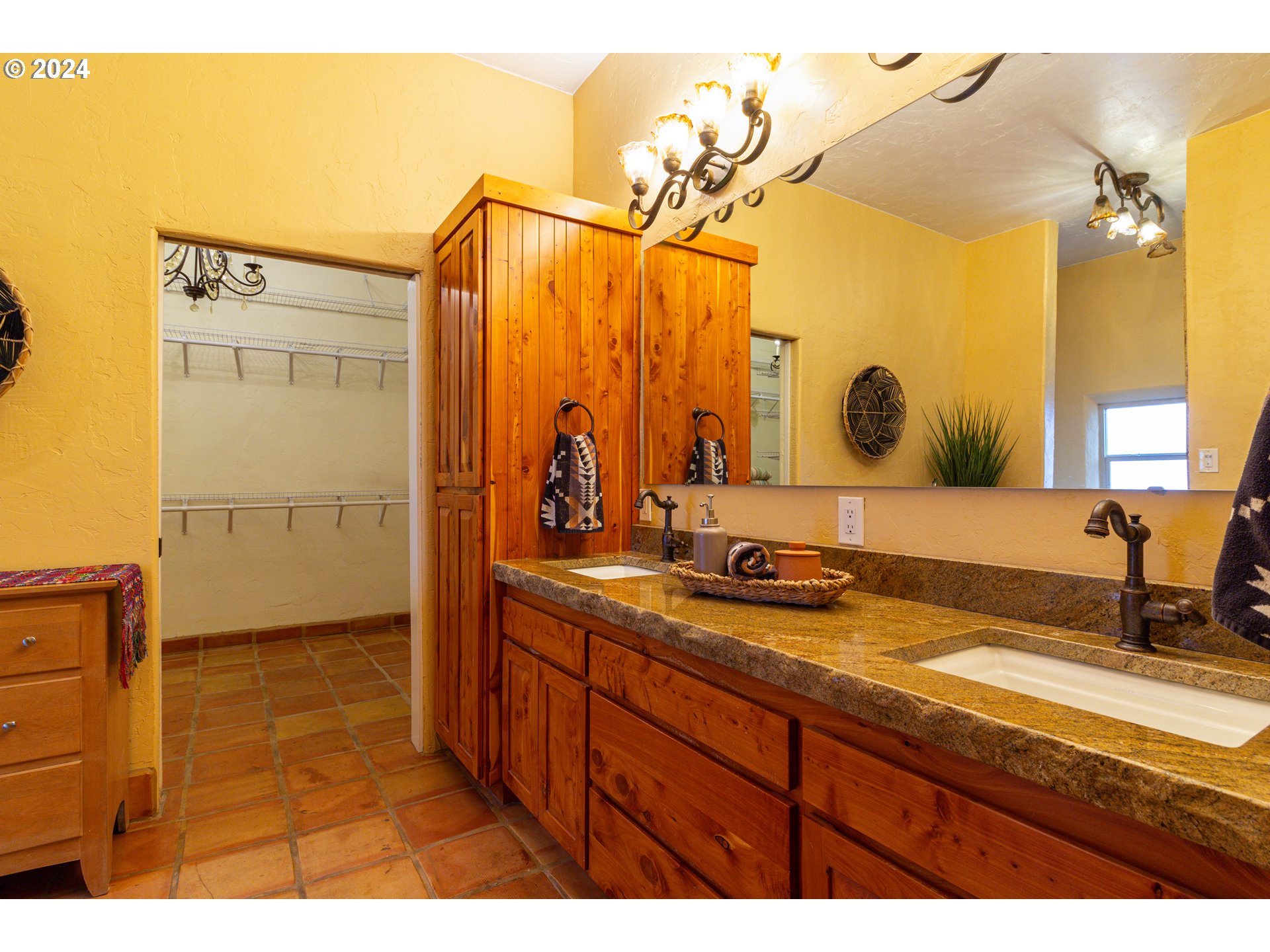 832 East Main Street Hermiston, OR 97838 - Photo 14 of 48 a bathroom with a sink double vanity and a mirror