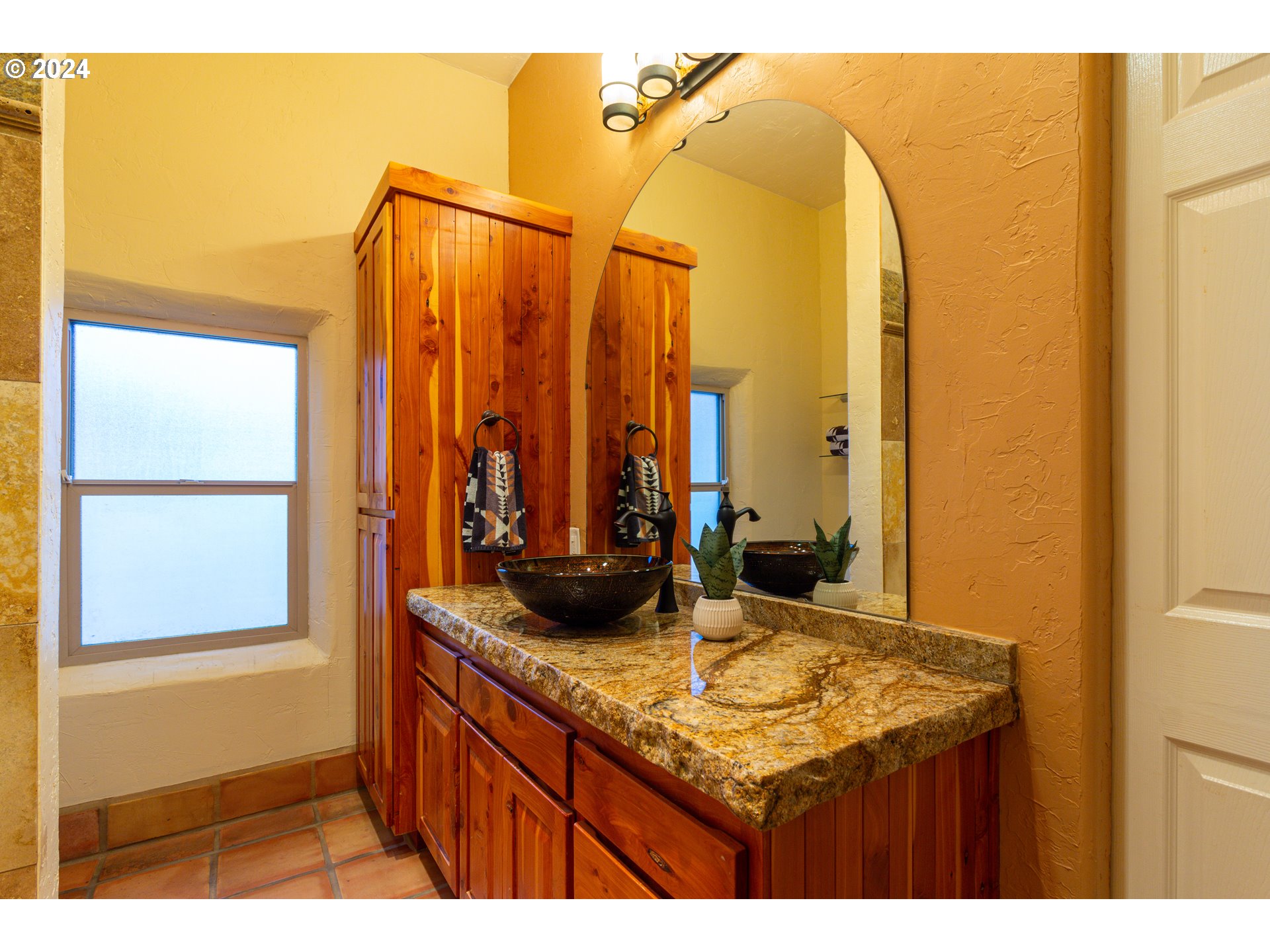 832 East Main Street Hermiston, OR 97838 - Photo 20 of 48 a bathroom with a granite countertop sink and a mirror