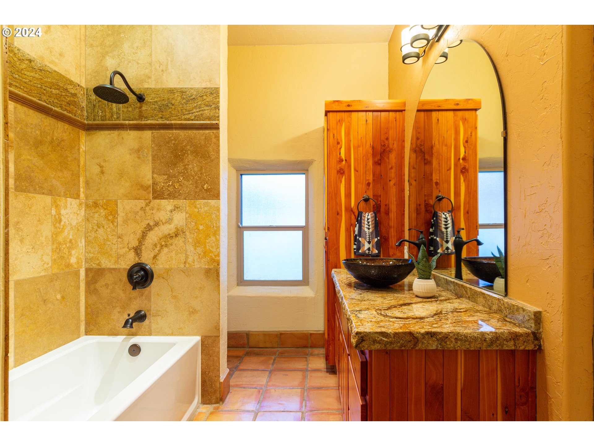 832 East Main Street Hermiston, OR 97838 - Photo 21 of 48 a bathroom with a tub and a sink